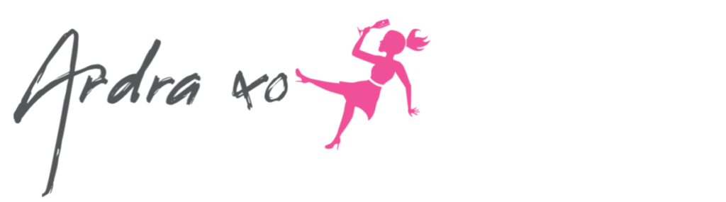 Ardra's signature and Tripping On Air logo which is a pink drawing of a woman in heels with a ponytail who is falling backwards. She's holding a champagne flute which she doesn't drop because, priorites. 