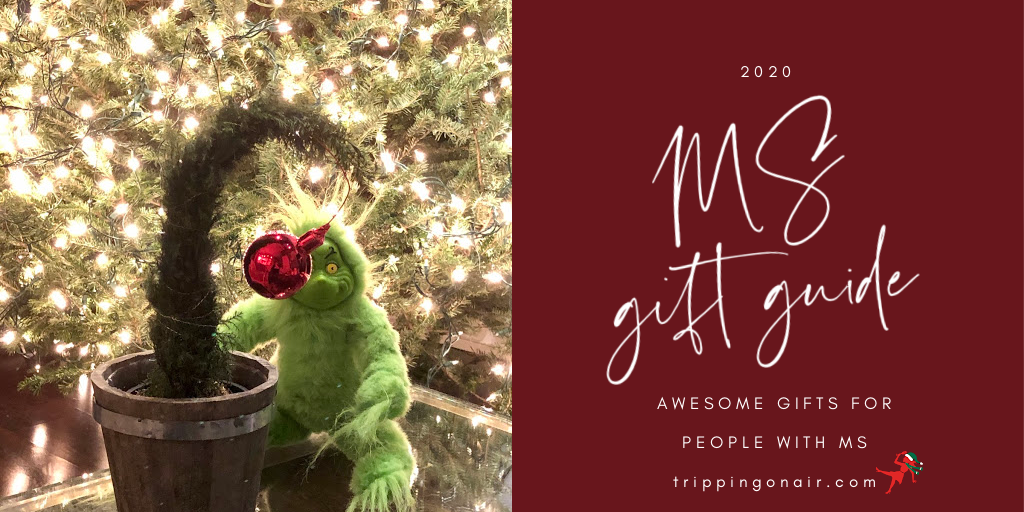 The Grinch sits in front of a well-lit Christmas tree. There is text on a red background that reads: 2020 MS gift guide: awesome gifts for people with MS TrippingOnAir.Com 